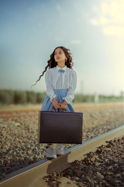 A young woman looking towards the horizon representing financial vision