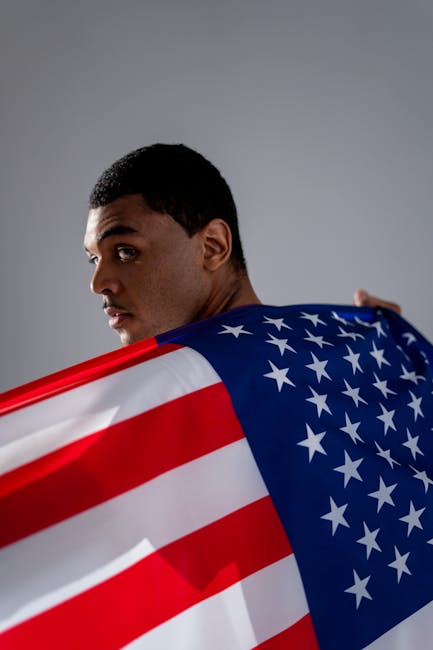 Man with American flag representing national stability and trust