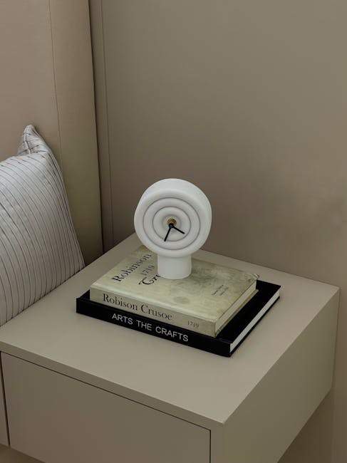 Clock and books representing time and financial wisdom